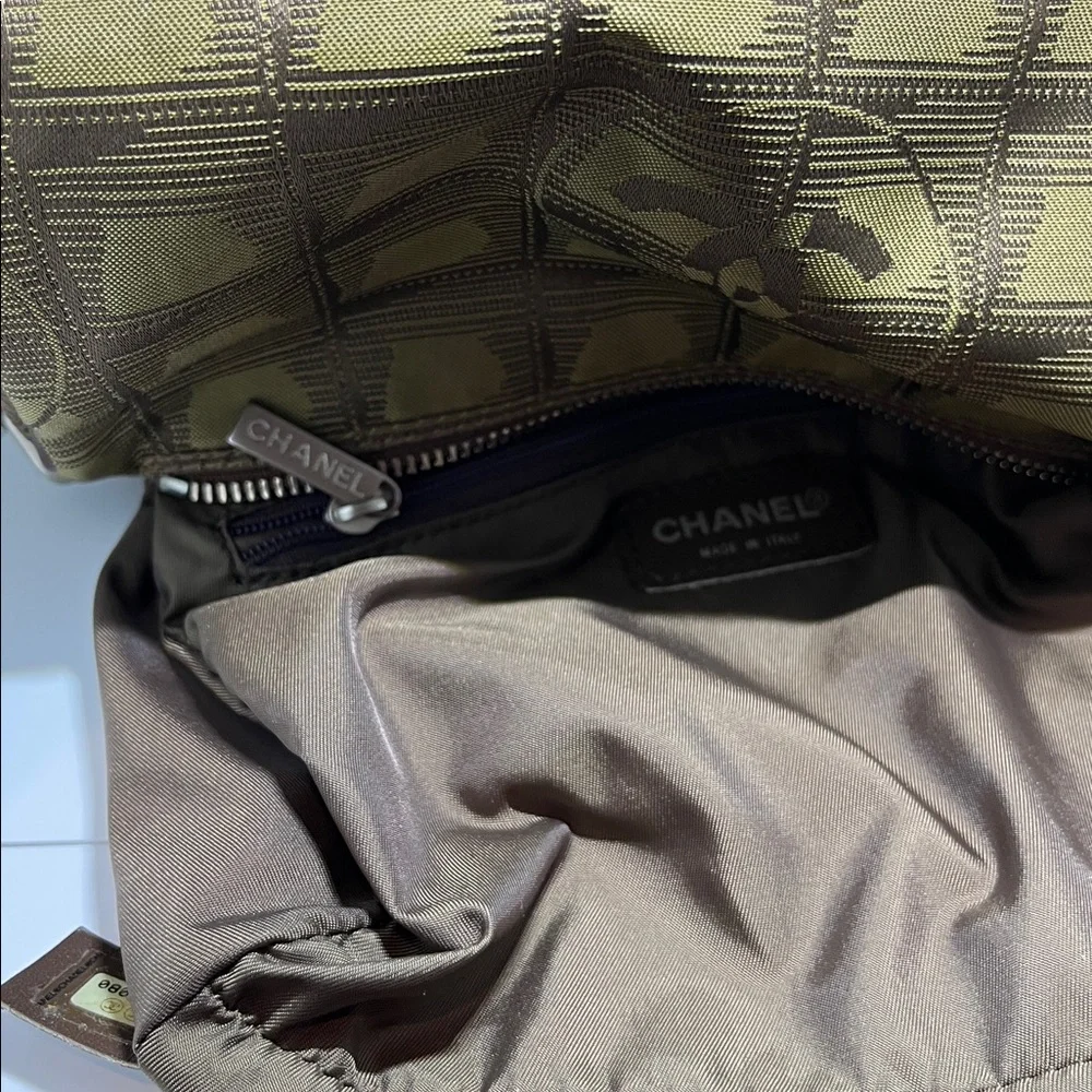 Chanel New Travel Line Mini Roll or Barrel Bag in a khaki or olive green color